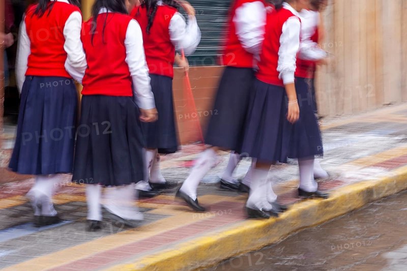 Group of female students walking to the college, Motion blur, City of Otavalo, Imbabura province, Ecuador, South America