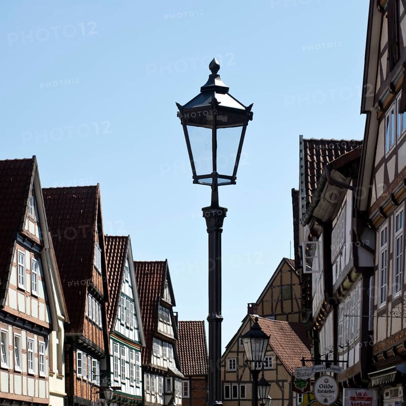 Street with half-timbered houses and historic street lamp in the old town centre, Celle, Lower Saxony, Germany