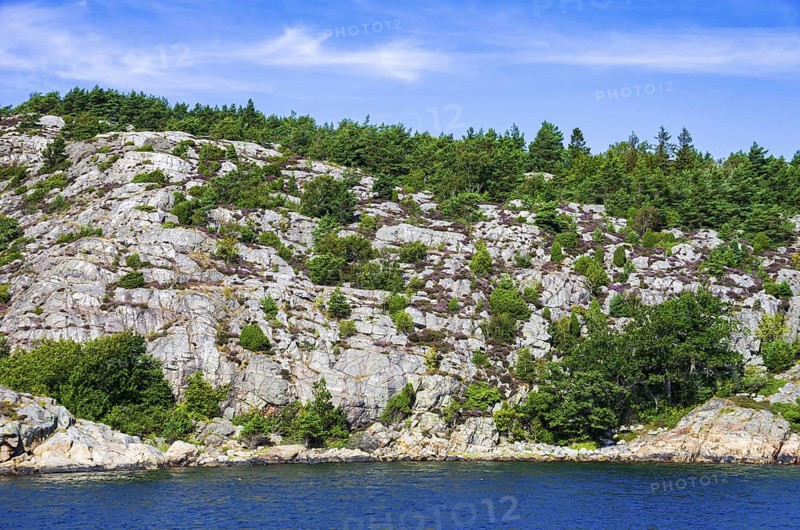 Wooded coastal landscape of granite rocks in the archipelago near Lysekil, Bohuslän, Västra Götalands län, Sweden, Scandinavia