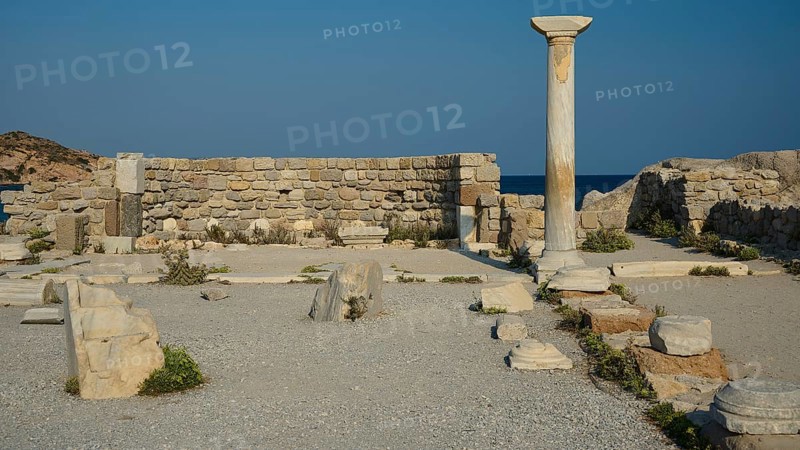 Ancient site with a single stone column and ruins, near the sea, Agios Stefanos Beach, Agios Stefanos Basilica, Agios Nikolaos Chapel, Kastri Island, Kos, Dodecanese, Greek Islands, Greece
