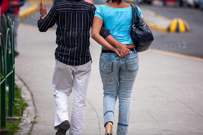 Couple walking in street, Hand in hand, City of Quito, Pichincha province, Ecuador, South America