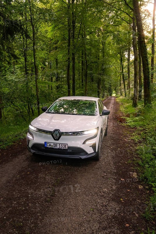 Renault drives on a shady forest path between tall trees, Deer E- CarSharing, Renault Megane electric car, Calw, Black Forest, Germany
