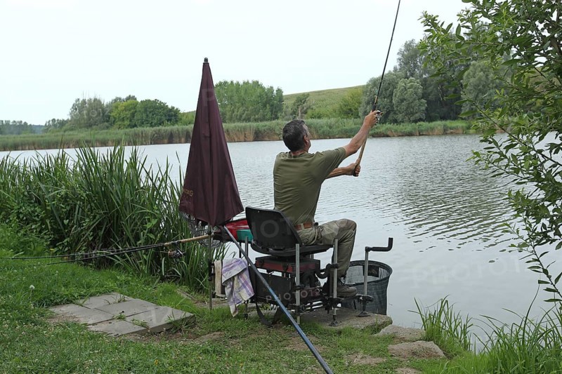 Fisherman, Angler casting a line at a lake, Southern Hungary, Hungary, Southern Hungary, Hungary