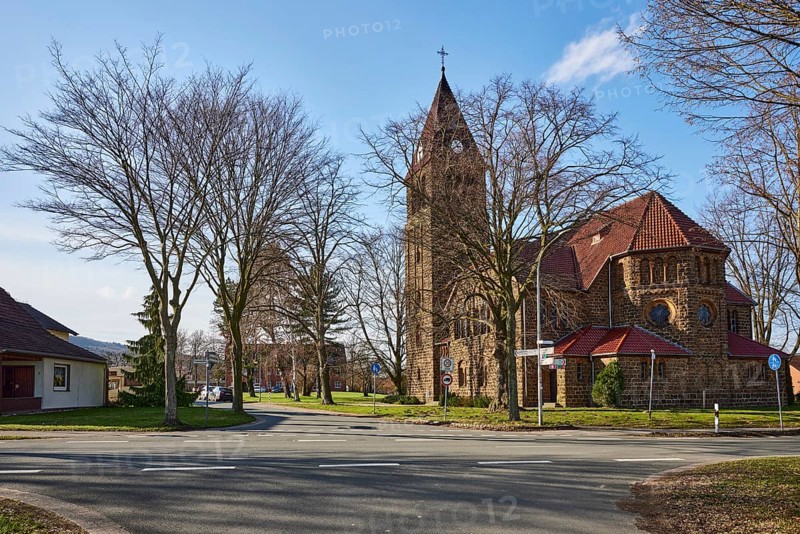 Church Oberlübbe, Evangelical-Lutheran parish Oberlübbe-Rothenuffeln, residential building, bare winter trees, blue sky with cumulus clouds, intersection Ellernstraße with Korfskamp, Hille, Mühlenkreis Minden-Lübbecke, North Rhine-Westphalia, Germany