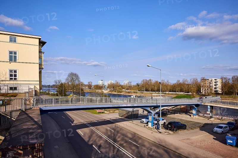 Pedestrian bridge, river Elbe, lantern, general architecture, bare wintry trees, blue sky, cumulus clouds, Fürstenwallsteg, street Schleinufer, Magdeburg, state capital, independent city, Saxony-Anhalt, Germany