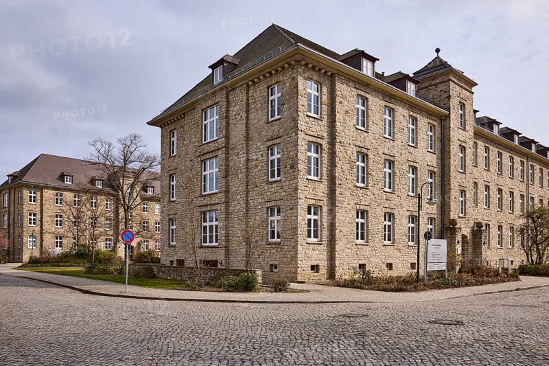 Tax office, sandstone building, bare wintry trees, diffuse light, slightly sunny, cloudy, street Tessenowstraße, Magdeburg, state capital, independent city, Saxony-Anhalt, Germany