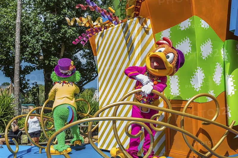Disney character riding on float during parade through the Frontierland area of Magic Kingdom at Walt Disney World, Orlando, Florida