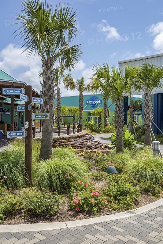 Sign directs guests to different attractions at Ocean Adventures Marine Park in Gulfport, Mississippi