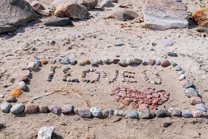 I Love You with heart on the beach with stones in the sand