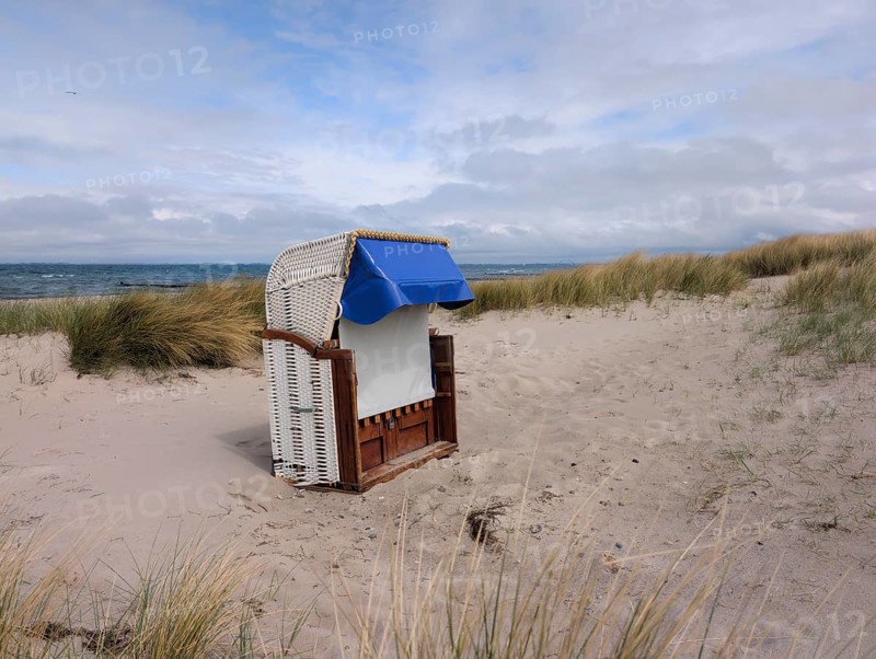 Beach chair dunes Strandwarder in front of Fehmarn bridge Heiligenhafen Baltic Sea Germany