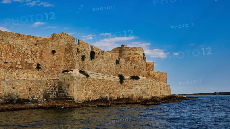 Castello Maniace, Sea Fortress Maniace, Mighty fortress along the coast, with robust architecture and blue sky, boat trip around the island of Ortigia, Isola di Ortigia, Syracuse, Sicily, Italy