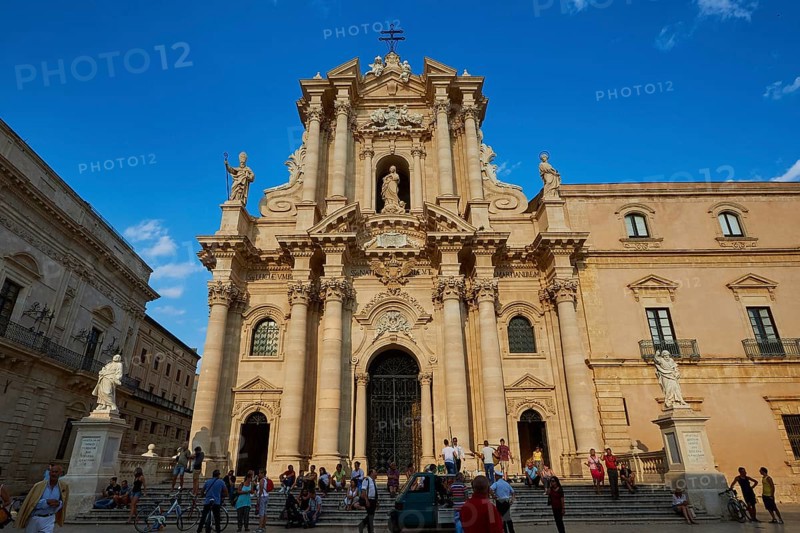Cathedral of Syracuse, Magnificent baroque cathedral with imposing façade under blue sky, Groups of people on the square, Ortigia Island, Isola di Ortigia, Historic old town, Syracuse, Sicily, Italy