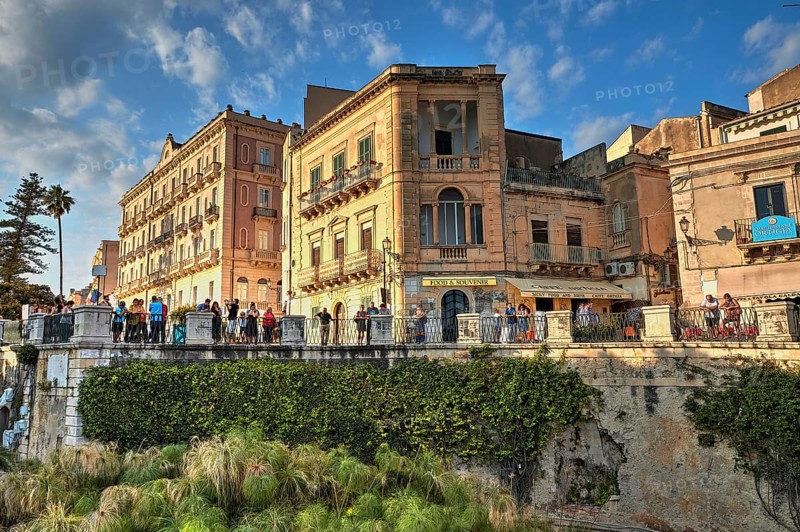 HDR, Largo Aretusa, Fonte Aretusa, Lively bridge in the old town with lush greenery and blue sky in the background, Ortigia Island, Isola di Ortigia, Historic old town, Syracuse, Sicily, Italy