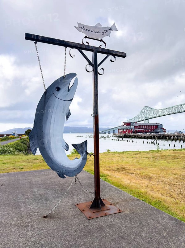 Fish sculpture in front of the Astoria Megler Bridge on the Columbia River, Astoria, Oregon, USA, North America