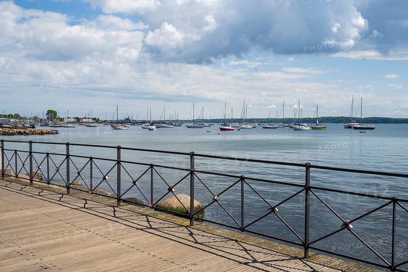 Sailboats in the harbour, promenade, dark clouds, Eckernförde, Baltic Sea, Schleswig-Holstein, Germany