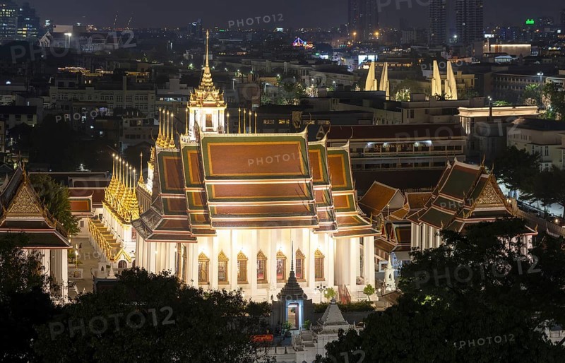 Panorama after sunset from Golden Mount to Wat Ratchanatdaram Worawihan and the Democracy Monument at the back right, skyline of Bangkok, Thailand