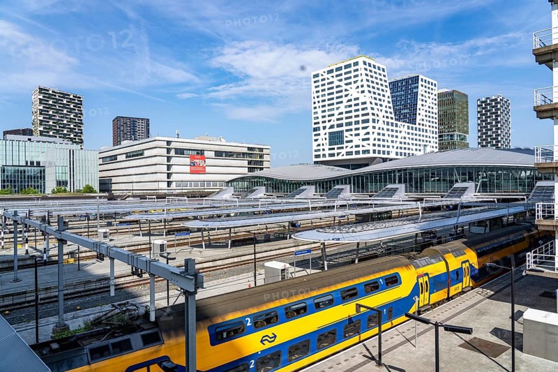 Utrecht Centraal railway station, tracks and concourse, trains of Nederlandse Spoorwegen N.V. state railway company, office building in the city centre, Netherlands