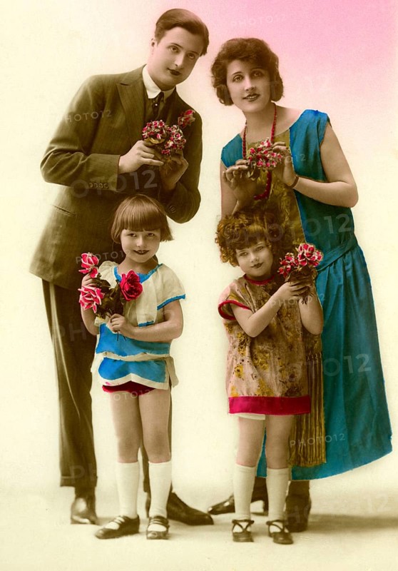 Family with flowers, 1930s, Family portrait with flowers in colourful clothes, smiling and posing, Historical photo