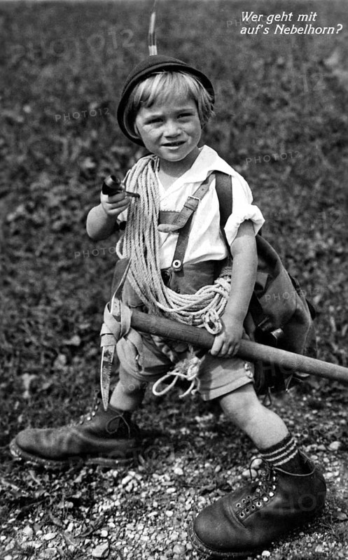 Mountaineering Nebelhorn, 1930s, A young boy in traditional clothing, equipped for mountaineering, smiles, Historical photo