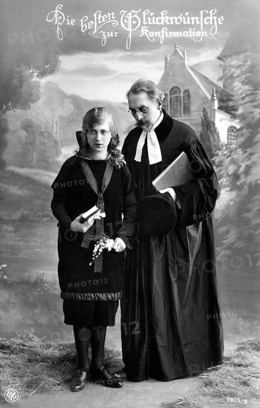 Girl with pastor, 1930, A pastor hands a book to a girl at a confirmation in a church, Historical photo