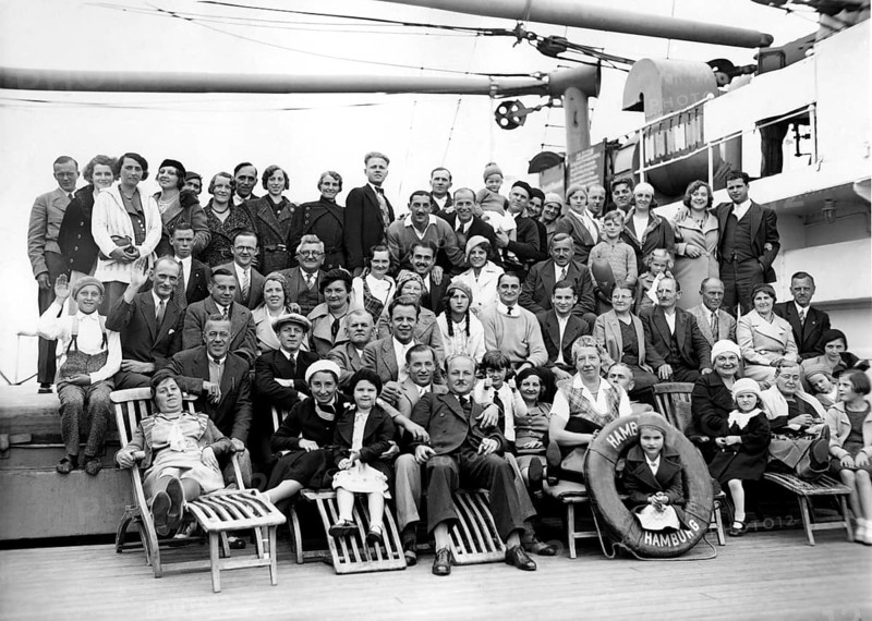 Group on ship deck, 1920s, Large group of people posing on a ship for a joint photo, Historical photo