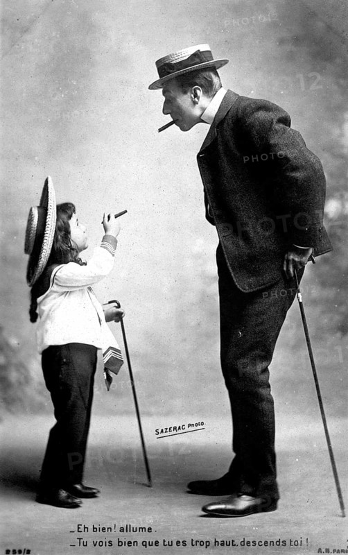 Girl asks man for a light, 1910, A father and his daughter humorously re-enact smoking, creating a whimsical scene, Historical photo