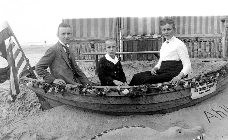 Family in a boat, beach, Baltic Sea, 1930s, Family sitting in a small boat on the beach, Historical photo