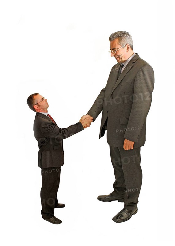 Businessman, two, big against small, suit and tie, Berlin, Germany, Smaller man in suit shakes hands with a much bigger man, symbolises respect, Historical photo