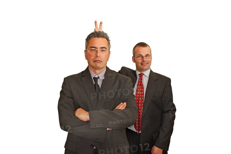 Businessman, two, suit and tie, Berlin, Germany, Two men in suits, the one in the back makes a humorous rabbit ears gesture behind the other, Historical photo