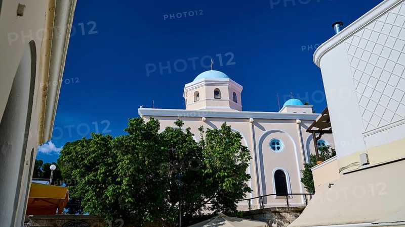 Mediterranean church with blue dome and green trees under a blue sky, Agia Paraskevi Church, Kos Town, Kos, Dodecanese, Greek Islands, Greece