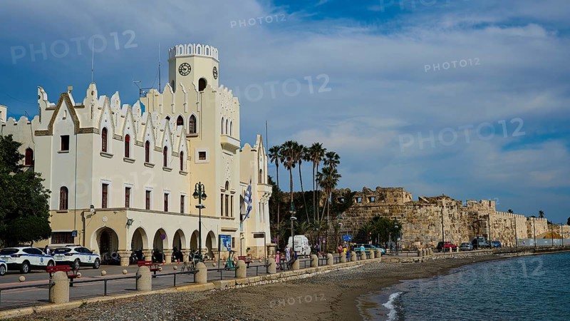 Waterfront promenade with historic building and sea view on a cloudy day, Governor's Palace, Kos Town, Kos, Dodecanese, Greek Islands, Greece