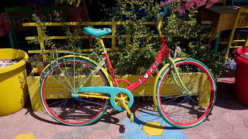 Colourful bicycle with 'i love kos' sign on a cobbled street, sunny atmosphere, Platia Diagora, Kos town, Kos, Dodecanese, Greek Islands, Greece