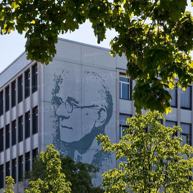 Vocational school centre Mitte Peter-Behrens-Schule with the portrait of Peter Behrens on the exterior facade, Darmstadt, Hesse, Germany