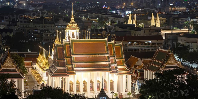 Panorama after sunset from Golden Mount to Wat Ratchanatdaram Worawihan and the Democracy Monument in the background on the right, skyline of Bangkok, Thailand
