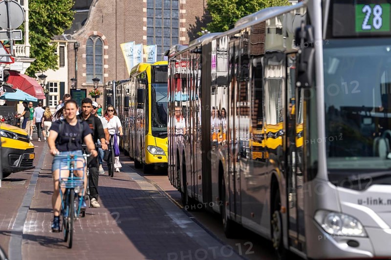 Central cycle path on the Lange Viestraat, lanes for pedestrians, cyclists and local traffic are separated in the city centre, dense traffic, no car/truck traffic, Utrecht, Netherlands