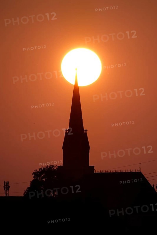 Sun in the evening in June, church tower, Germany