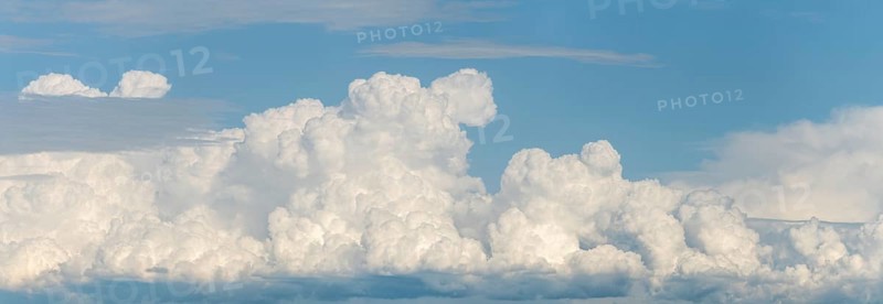 A large cloud in the sky. The sky is blue. The cloud is white.Bas rhin, Alsace, grand est, France