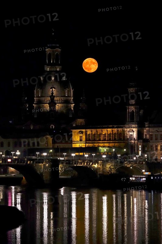 Glowing strawberry moon on 11 June 2025 next to the Church of Our Lady Dresden, Saxony, Germany