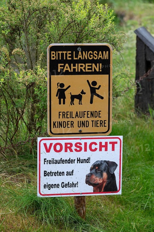 Warning signs in front of a farm, Bavaria, Germany