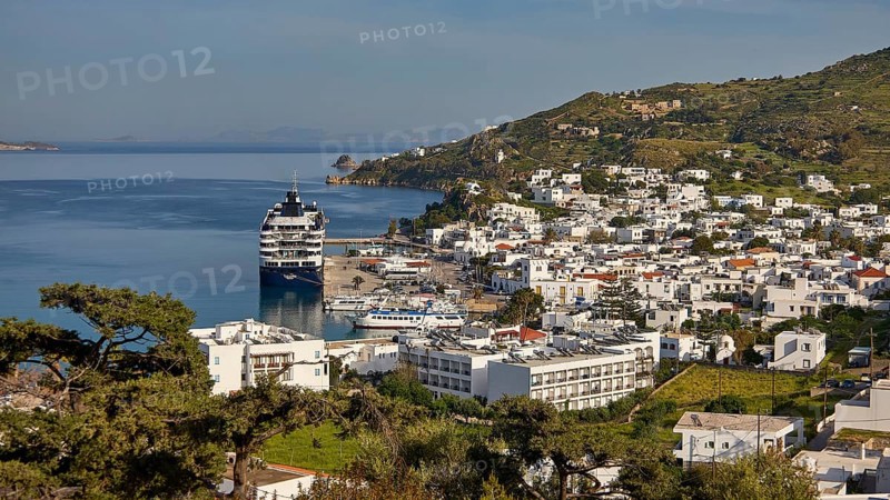 Coastal town with cruise ship and houses, sea and mountains in the background, Skala, harbour, Patmos, Dodecanese, Greek Islands, Greece