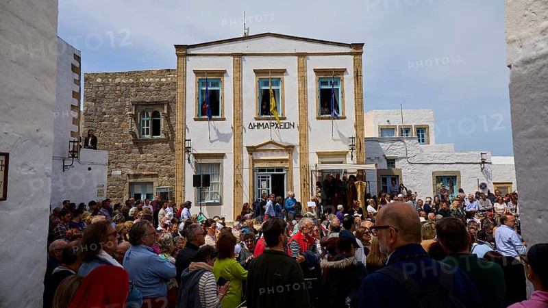 A large crowd gathers in front of a civic building during a civic celebration, Orthodox ceremony, monks of St John's Monastery, ceremonial washing of feet, procession, Maundy Thursday, Megali Pempti, Chora, Patmos, Dodecanese, Greek Islands, Greece