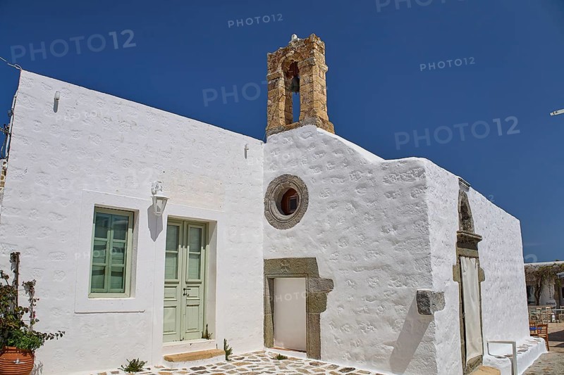 Chapel on Platia Lesvias, Mantomata stones, White building with historic charm and blue sky, Church, Chora, World Heritage Site 1999, Patmos, Dodecanese, Greek Islands, Greece