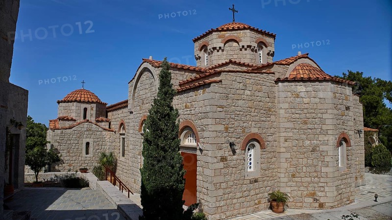 Large stone church building with several domes and a cross in the courtyard, woman's monastery, Evangelismou Monastery, Patmos, Dodecanese, Greek Islands, Greece