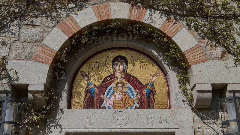 Mosaic above a door shows Mother of God with child, embedded in stone wall, woman's monastery, Evangelismou Monastery, Patmos, Dodecanese, Greek Islands, Greece