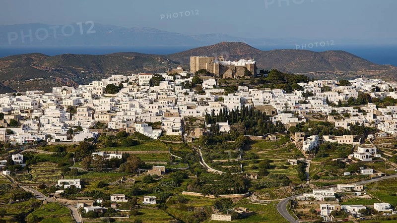 Panoramic view of a whitewashed village on a hill with a fortress on top, Monastery of St John the Theologian, Monastery of St John the Theologian, World Heritage Site 1999, Chora, Patmos, Dodecanese, Greek Islands, Greece