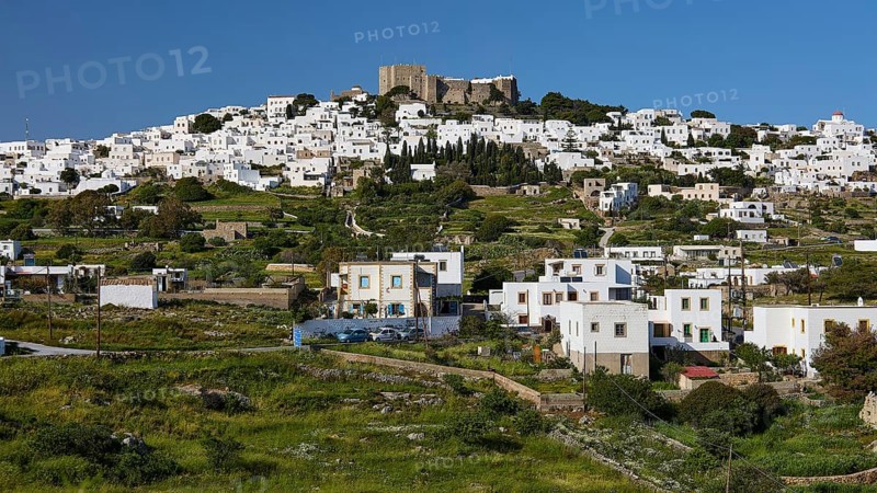 Whitewashed Mediterranean houses on a hill, crowned by an old fortress, Monastery of St John the Theologian, Monastery of St John the Theologian, World Heritage Site 1999, Chora, Patmos, Dodecanese, Greek Islands, Greece