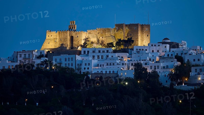 Illuminated castle high above white houses at night, Monastery of St John the Theologian, Monastery of St John the Theologian, World Heritage Site 1999, Chora, Patmos, Dodecanese, Greek Islands, Greece