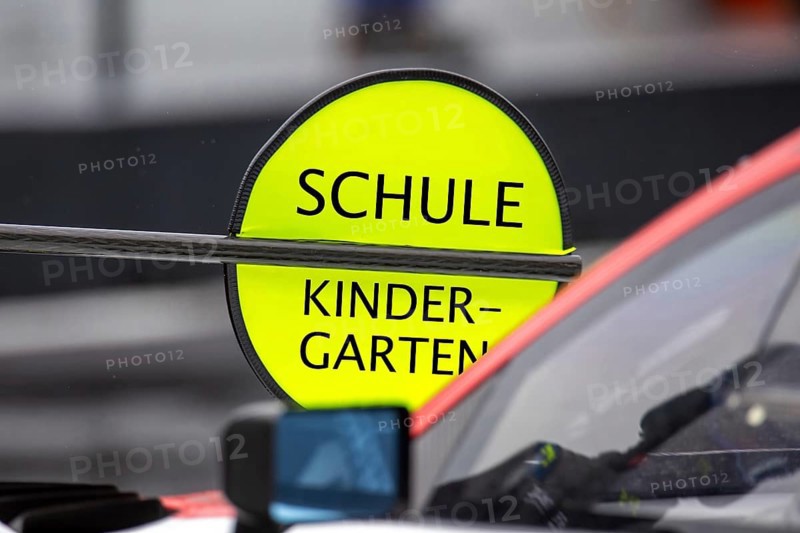 (Photomontage) Kindergarten/School Symbol image: Lollipop in motorsport with modified text KINDERGARTEN / SCHOOL