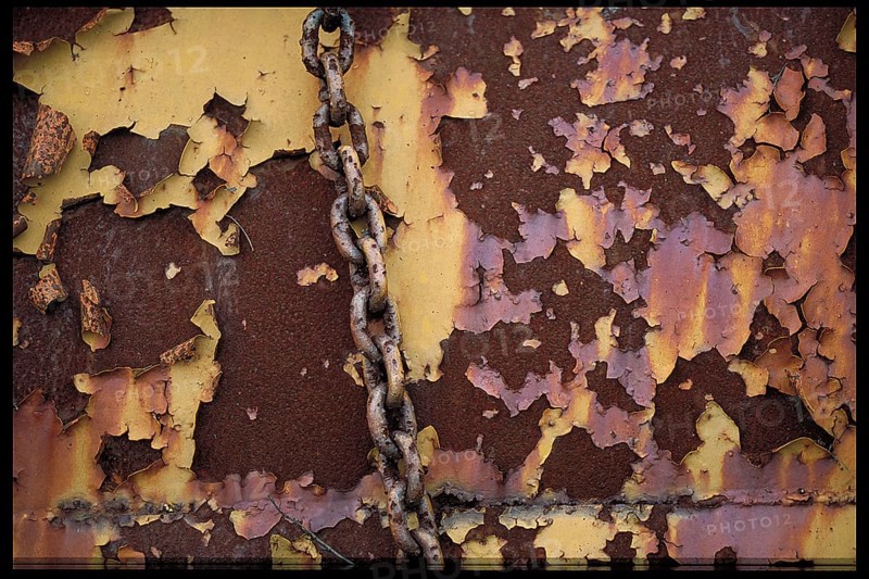 Rusty chain on an old steel wall, Bavaria, Germany