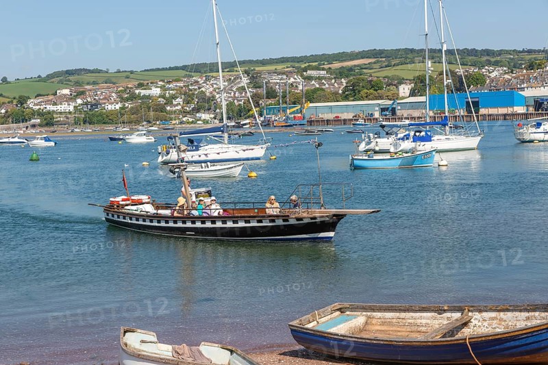 Shaldon ferry arriving, small boats in harbour at Back Beach, Teignmouth, south Devon, England, UK